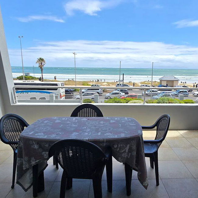 Da Gama 1st Floor Seafront Strand SA Cape Holidays Outside Table